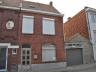 Verzorgde woning met living, eetplaats, keuken, badkamer, 2 slaapkamers,vaste trap naar zolder, keld